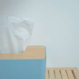A box of tissues on a shelf.