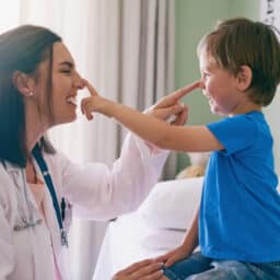 Child playing with the doctor at an allergy testing appointment